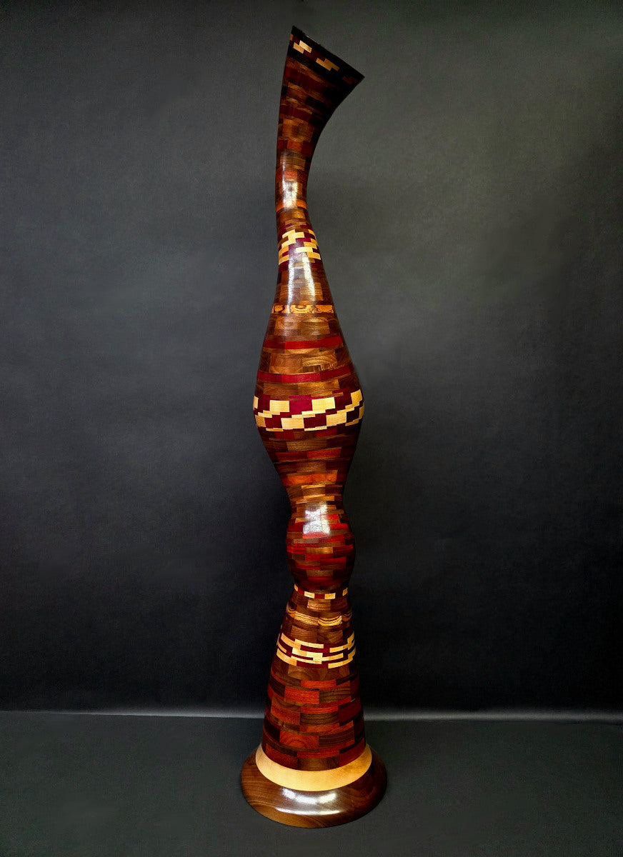 Wooden vase with a geometric pattern on a dark background